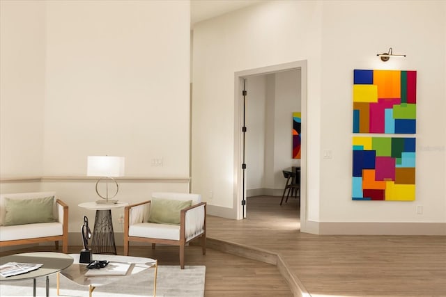 sitting room featuring wood finished floors and baseboards