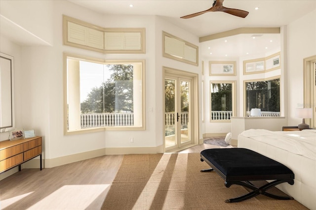 bedroom with baseboards, recessed lighting, wood finished floors, and access to exterior