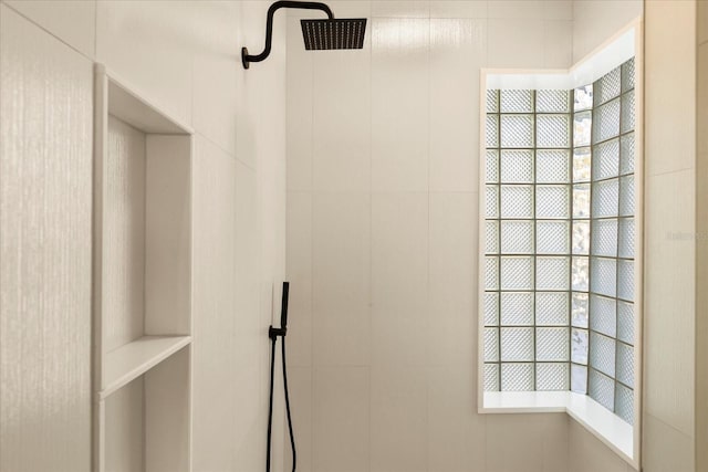 interior space featuring a tile shower