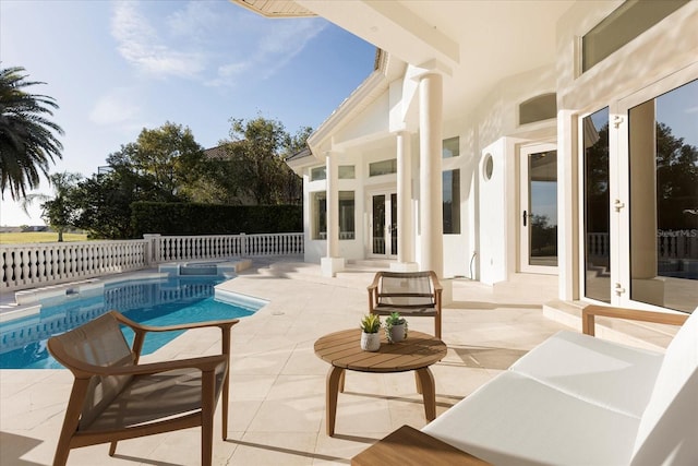 view of swimming pool with a fenced in pool, french doors, a patio, and fence