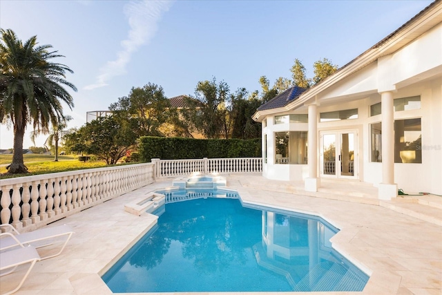 view of swimming pool featuring a fenced in pool, a patio, and french doors