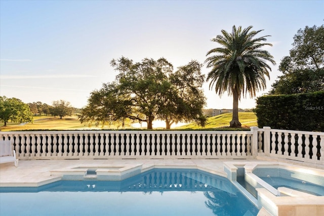 outdoor pool with an in ground hot tub