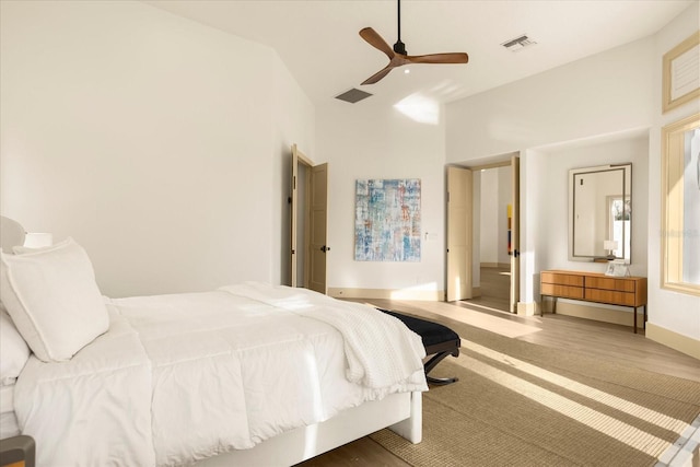 bedroom featuring visible vents, baseboards, and a ceiling fan