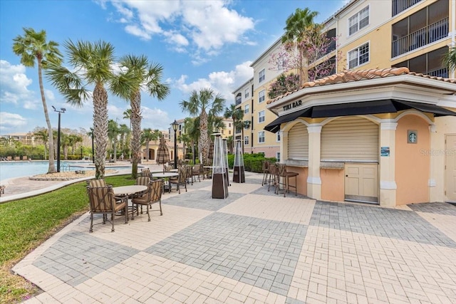 surrounding community featuring a patio area