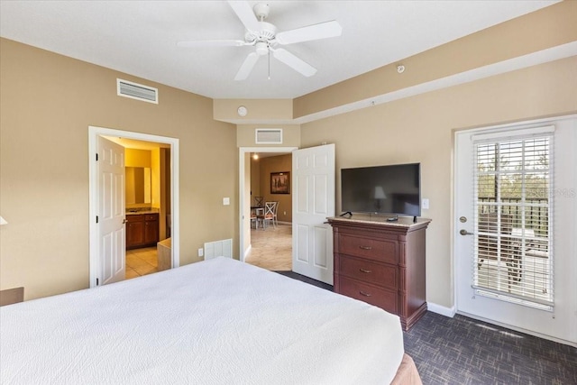 bedroom featuring access to exterior, baseboards, and visible vents