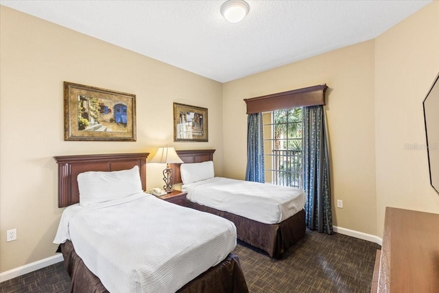 bedroom featuring baseboards