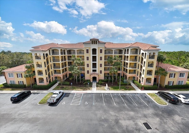 view of property with uncovered parking