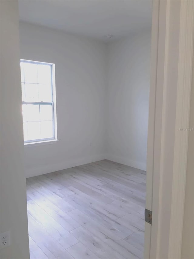 unfurnished room featuring light wood finished floors
