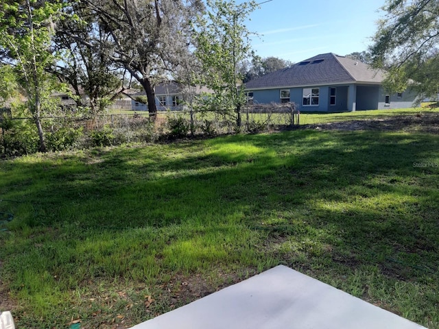 view of yard with a patio and fence