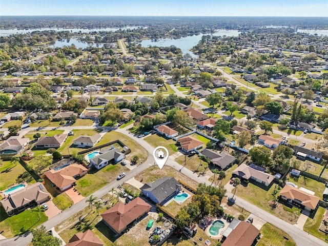 aerial view with a residential view and a water view