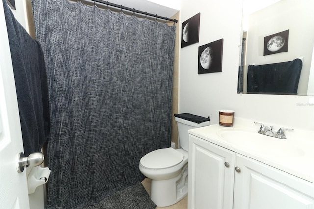 bathroom with vanity, toilet, and a shower with curtain