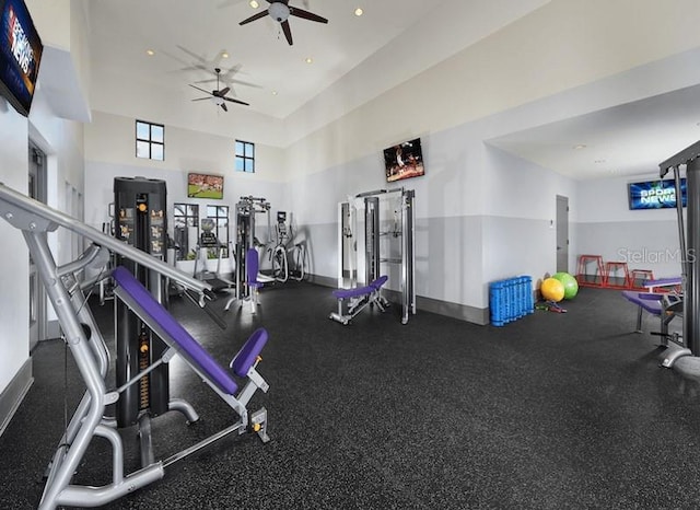 workout area featuring recessed lighting, a ceiling fan, and baseboards