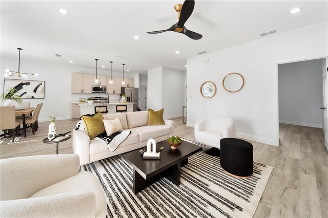 808 Tedder Rd SE, Palm Bay, FL 32909 - living room featuring recessed lighting, visible vents, and light wood-style flooring
