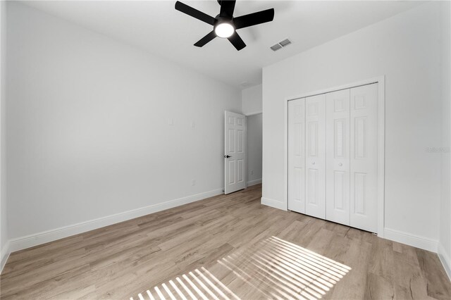 808 Tedder Rd SE, Palm Bay, FL 32909 - unfurnished bedroom with light wood-style flooring, a closet, visible vents, and baseboards
