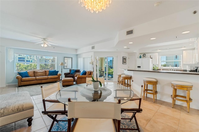 dining area with light tile patterned flooring, visible vents, and recessed lighting