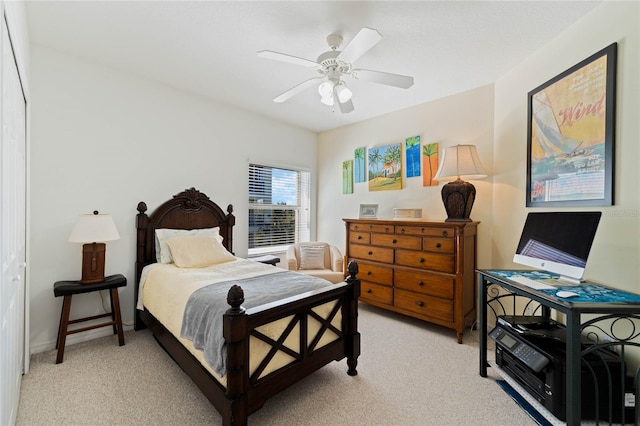 bedroom featuring light carpet, ceiling fan, and baseboards