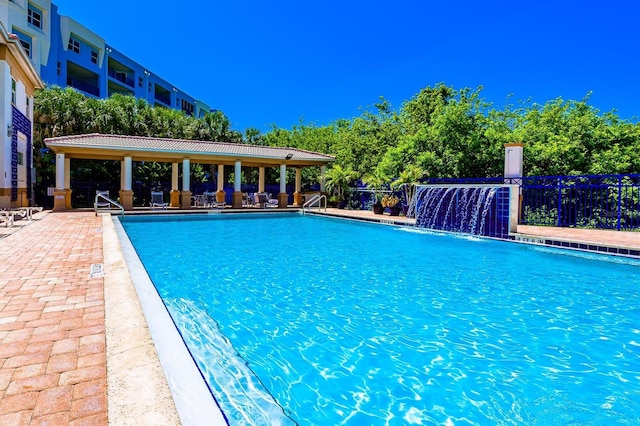 community pool featuring a patio area