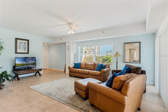 5300 S Atlantic Ave Unit 7-301, New Smyrna Beach, FL 32169 - living room with light tile patterned flooring, a ceiling fan, and baseboards