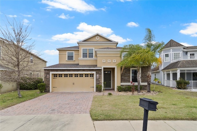 view of front of home featuring stucco siding, a front lawn, decorative driveway, stone siding, and an attached garage