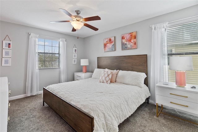 carpeted bedroom with ceiling fan and baseboards