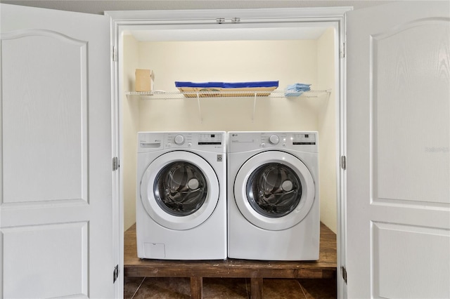 clothes washing area featuring tile patterned flooring, laundry area, and independent washer and dryer