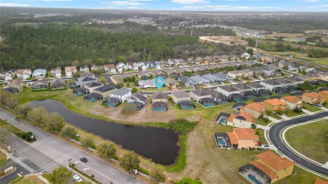 bird's eye view featuring a residential view and a water view