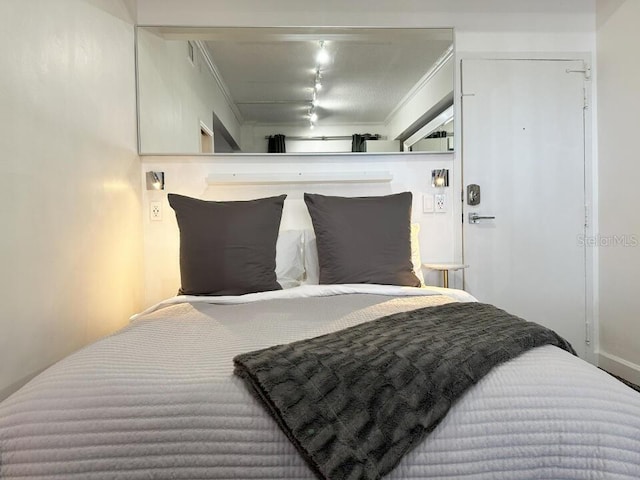 bedroom featuring crown molding