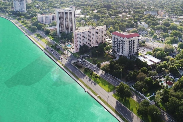 drone / aerial view featuring a water view and a city view