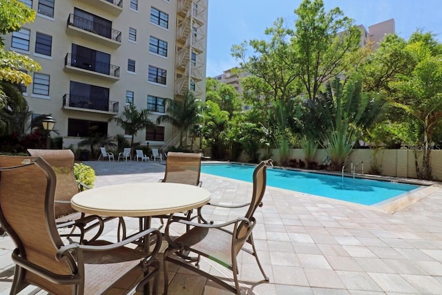 community pool featuring a patio