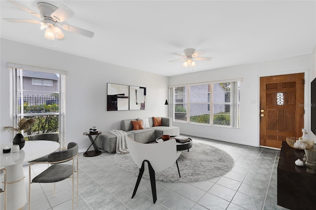 tiled living area featuring ceiling fan