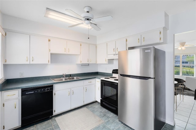 kitchen with electric range oven, under cabinet range hood, a sink, freestanding refrigerator, and dishwasher