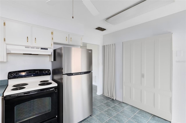 kitchen with under cabinet range hood, visible vents, white cabinetry, electric stove, and freestanding refrigerator