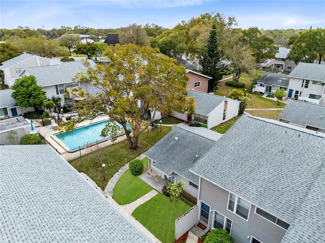 birds eye view of property with a residential view