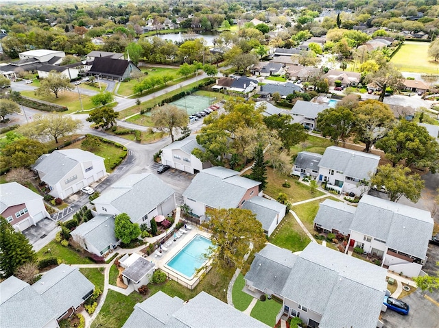 drone / aerial view with a water view and a residential view