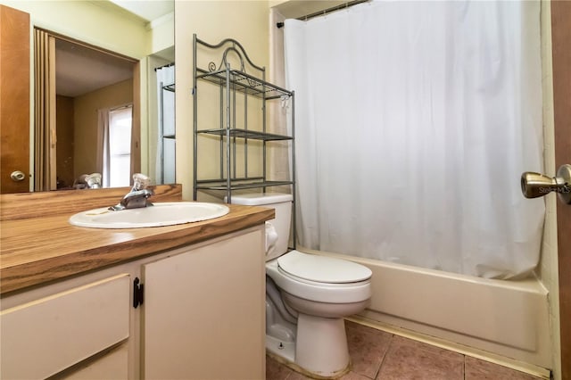 bathroom with tile patterned flooring, toilet, vanity, and shower / bath combo with shower curtain