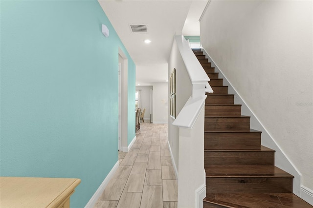 stairs featuring recessed lighting, baseboards, and visible vents