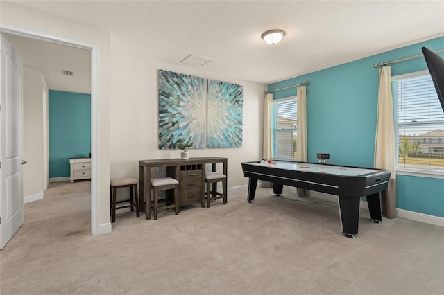 recreation room with visible vents, baseboards, and carpet