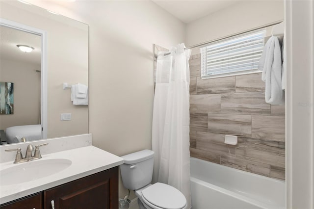 full bathroom featuring vanity, toilet, and shower / bath combo with shower curtain