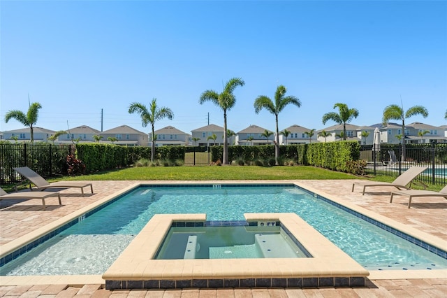 view of pool with a residential view, a patio, and a fenced backyard