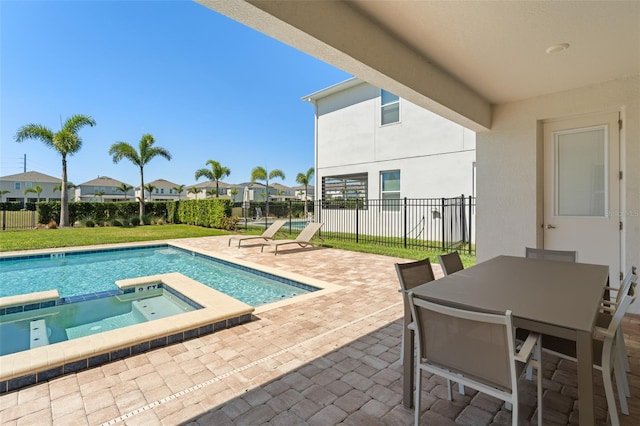 view of swimming pool featuring outdoor dining area, a patio area, fence, and a pool with connected hot tub