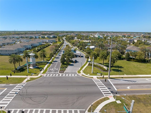 birds eye view of property with a residential view