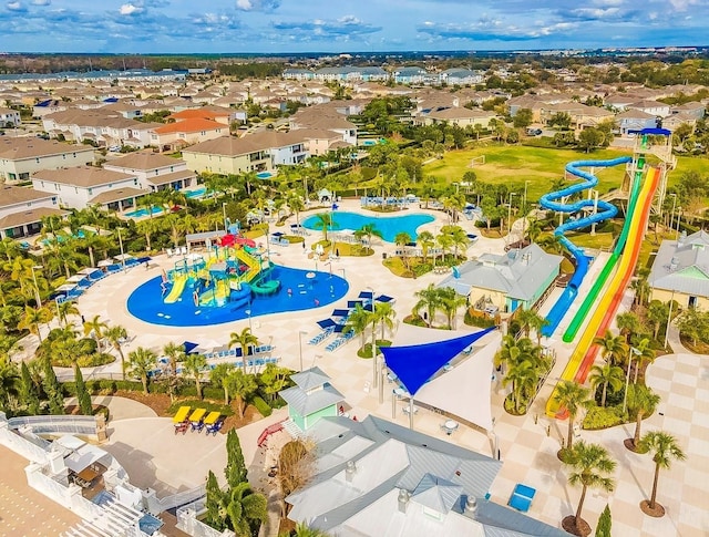 birds eye view of property with a residential view