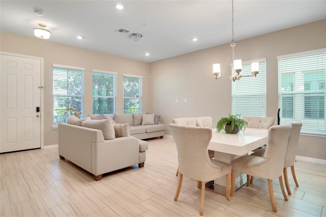 dining space with recessed lighting, visible vents, a notable chandelier, and baseboards