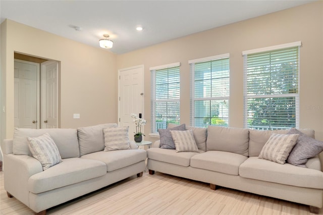 living room featuring recessed lighting and light wood finished floors