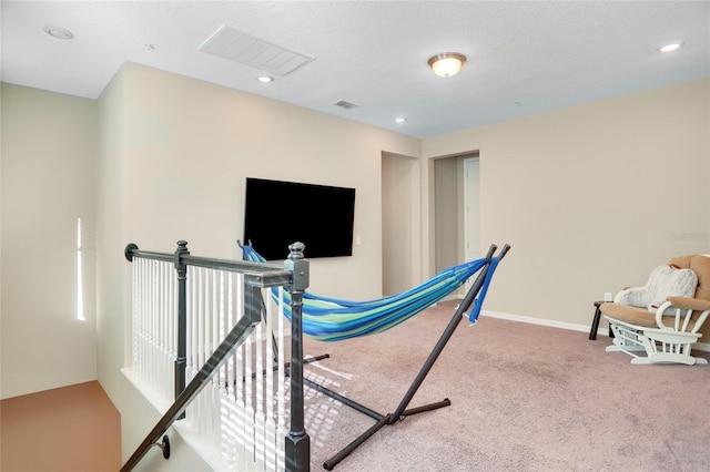 workout area with carpet floors, baseboards, visible vents, and recessed lighting