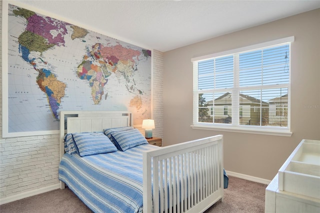 bedroom with baseboards and carpet flooring