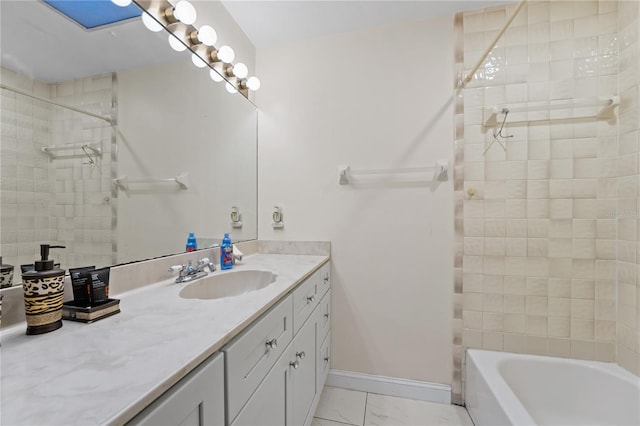 bathroom featuring vanity, baseboards, marble finish floor, and shower / washtub combination