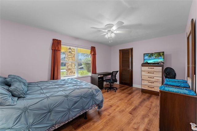 bedroom with light wood-style floors and ceiling fan