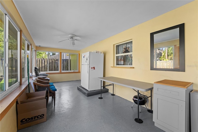 interior space featuring plenty of natural light and a ceiling fan