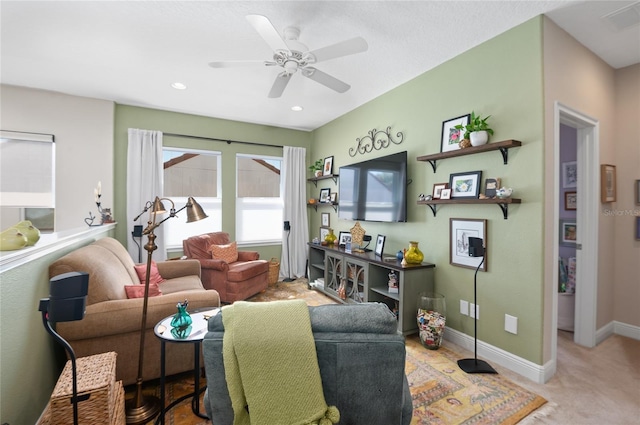 carpeted living room with visible vents, recessed lighting, baseboards, and ceiling fan